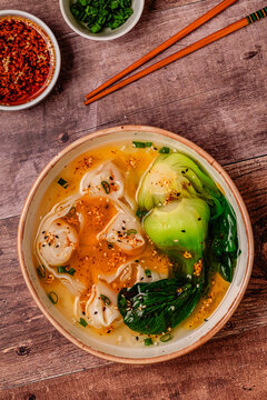Soup with wontons and bok choy