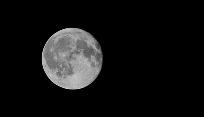 Fototapeta premium Beautiful full moon with visible surface and craters on the moon, astrophotography