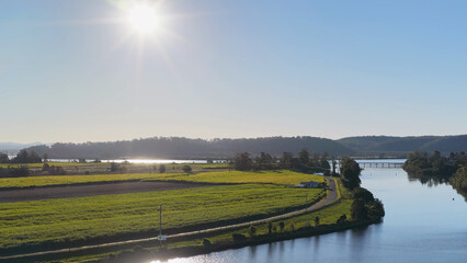 Fototapeta premium Aerial View of Clarence River and Sugarcane Fields in Gulmarrad