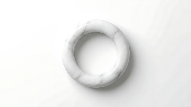 White marble torus ring on minimalist white background.
