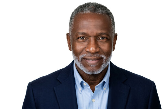 Man looks at camera with smile wearing navy blazer and light blue shirt. Clean and bright setting highlights friendly demeanor. Concept of corporate branding, networking, personal relationships