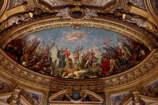 A fresco painted inside the Senate building in Paris, France, depicting an allegorical scene adorned with majestic gilding.