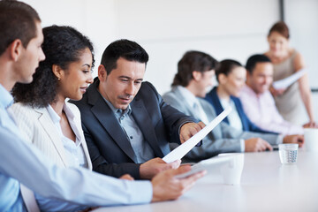 Fototapeta premium People, lawyer and meeting in office with document, case file and witness statement for legal trial. Attorney, team and review paperwork for evidence, lawsuit investigation and agenda of court summon