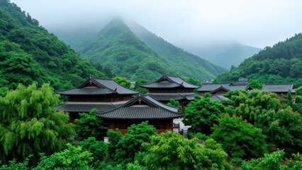 Fototapeta premium Traditional Asian Temple Complex Surrounded by Lush Green Mountains