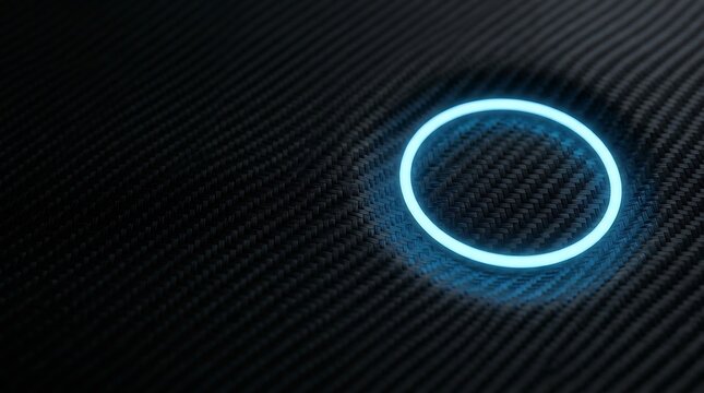 Glowing cyan neon circle light ring on a dark black carbon fiber textured surface with a subtle circular indentation in the background