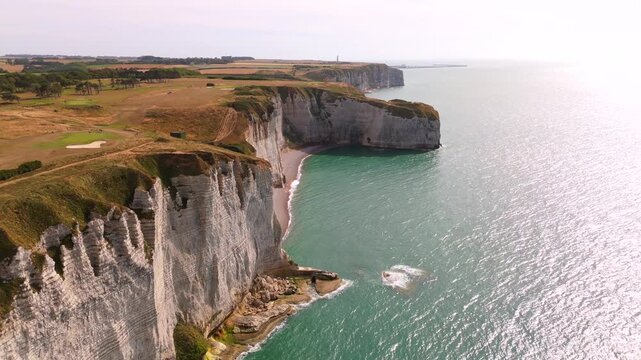 An aerial view reveals the white chalk cliffs of the Alabaster Coast near Etretat, France.
