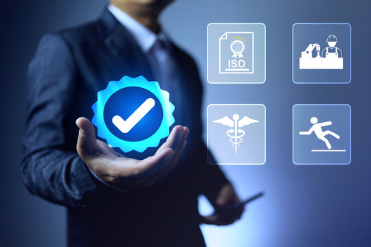 health and safety workplace concept with a businessman holding certified check mark represents got approved certificate occupational health and safety management system