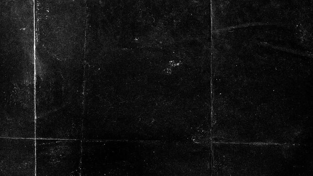 Distressed black chalkboard texture with scratches and dust overlay