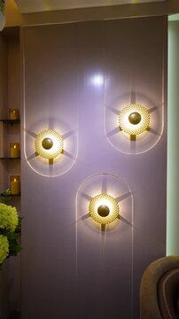 Modern interior wall with golden lights. Luxury home decor design in Delhi NCR apartment.