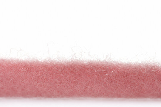 Macro soft pink felt ribbon texture on white, Generative AI