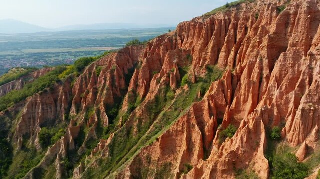 Stob Pyramids rock formations aerial drone view sand sandstone cliffs erosion landscape sunset light Rila mountains Bulgaria natural landmark travel destination