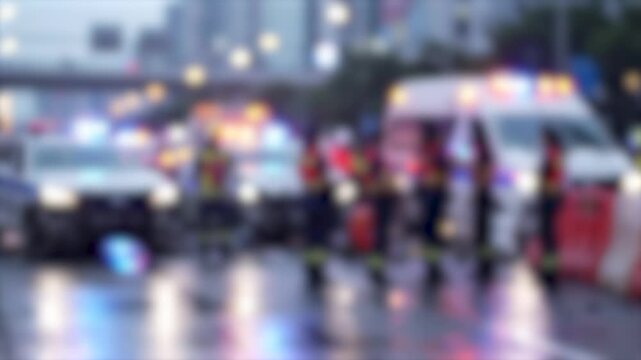 Abstract Blurred Emergency Medical Response Scene with Ambulances and First Responders on Urban Street