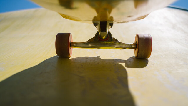 Low angle view of longboard on skate ramp