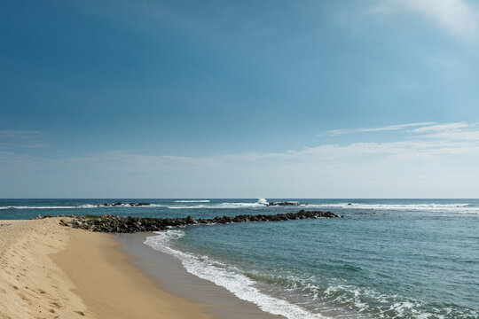 A wave breaker on beach. Mirissa, Sri Lanka