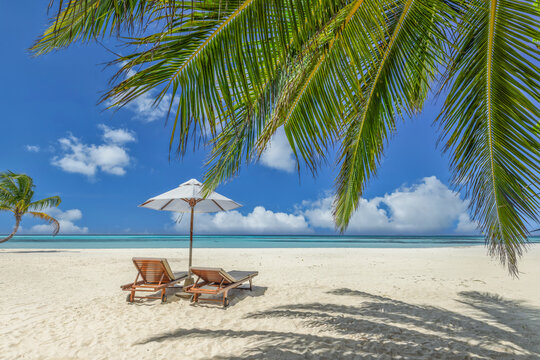 Beautiful panoramic sea sand sky. Tropical relax beach sunny summer island landscape. Love couple chairs umbrella palm leaves romantic coast. Luxury travel destination. Honeymoon vacation best holiday