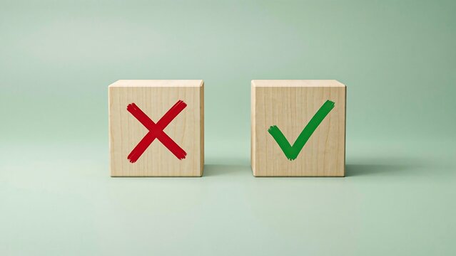 Wooden blocks with correct and incorrect symbols on green background