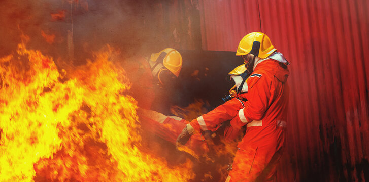 Firefighters in full gear battle intense flames
