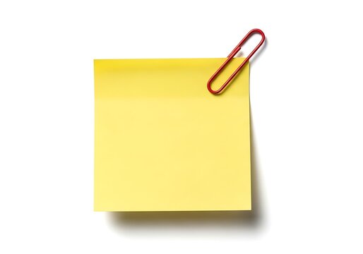 A yellow sticky note with a red paperclip