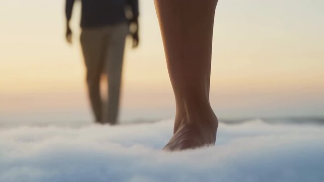 Bare foot pressing into soft cloudlike surface with blurred standing figure in sunrise glow, creating surreal intimate mood and gentle depth, with foot, barefoot, leg, toes detail