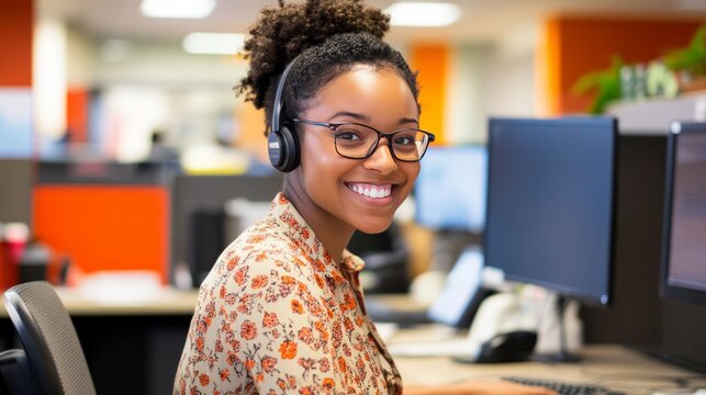 Smiling Woman in Headset Working in Modern Office Environment