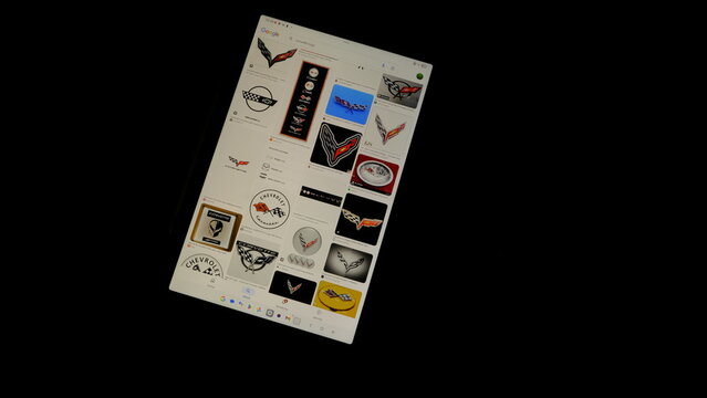 Tablet screen view with various sized Corvette logos, on a black background, August 1, 2026