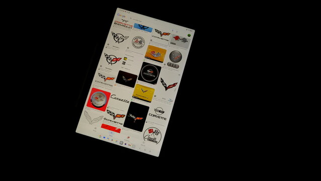 Tablet screen view with various sized Corvette logos, on a black background, August 1, 2026
