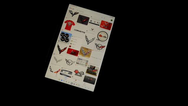 Tablet screen view with various sized Corvette logos, on a black background, August 1, 2026