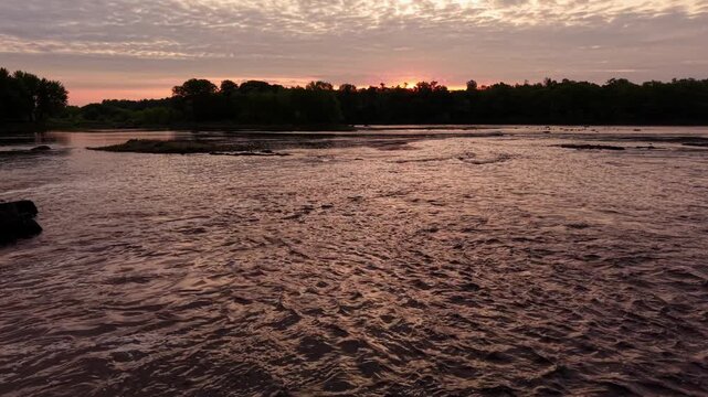Moving down the Penobscot River in Howland, Maine toward a folk of birds just before sunrise