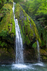 Kaghu Waterfall, located in the Samegrelo region of Georgia, A vibrant waterfall cascades down a mossy stone © k_samurkas