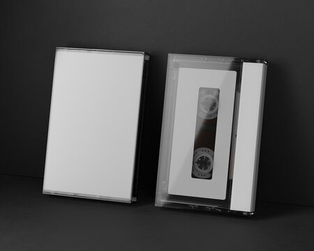 3d render. A mock-up of an audio cassette with a box on a black background. Retro aesthetics, clean composition, ideal for design and media projects.