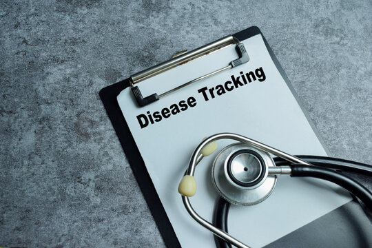 Concept of disease tracking write on clipboard isolated on Wooden Table.