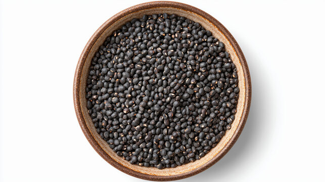 Top view of a bowl filled with dried black urad dal isolated on white background