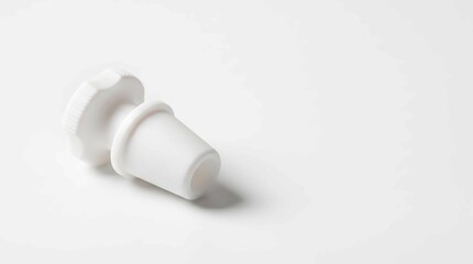 Obraz premium White rubber laboratory stopper. Conical plug for chemical glassware and industrial vials.