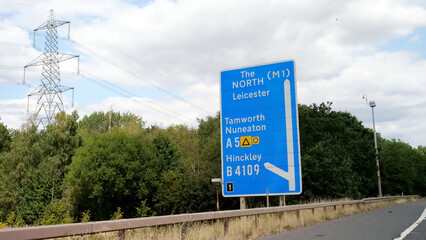Signpost, road, sign, direction, highway, UK blue motorway directional signpost showing routes to North M1 Leicester, Tamworth and Nuneaton © Adrenaloby