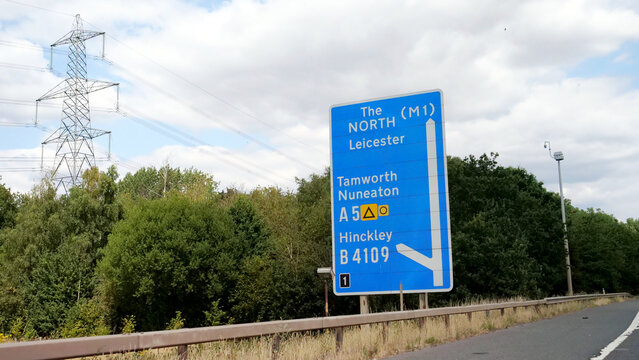 Signpost, road, sign, direction, highway, UK blue motorway directional signpost showing routes to North M1 Leicester, Tamworth and Nuneaton