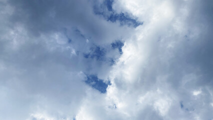 Fototapeta premium Dense white and grey clouds gathering in blue sky