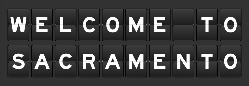 Black color analog flip board with word welcome to sacramento on gray background