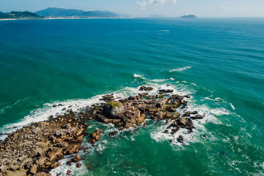 Coastline with ocean and waves in Brazil. Aerial view of Ponta das Campanhas