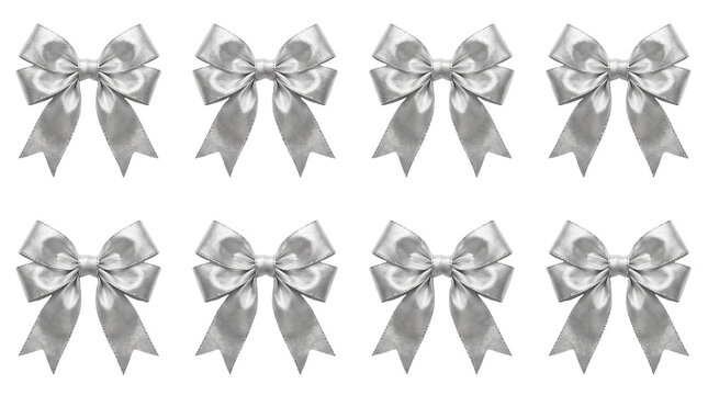 Eight elegant metallic silver fabric ribbon bows arranged in two neat horizontal rows featuring a shiny satin texture and festive decorative appeal for holiday gift wrapping projects isolated on a cle