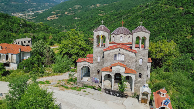 Aerial view of sinking leaning church of Agia Paraskevi ruined by landslide disaster in abandoned ghost village Ropoto Trikala Thessaly Greece for stock photo