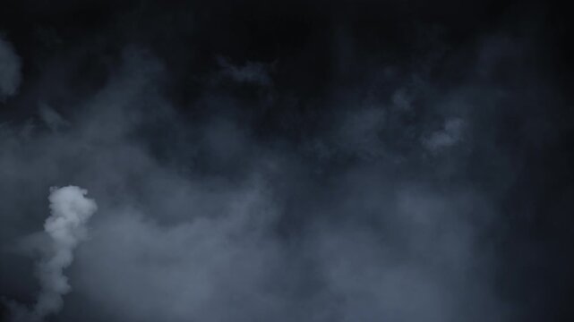 Spooky cinematic smoke VFX element with mysterious white haze slowly drifting in darkness, creating an atmospheric Halloween mood. Abstract volumetric smoke cloud floating in slow motion on black 