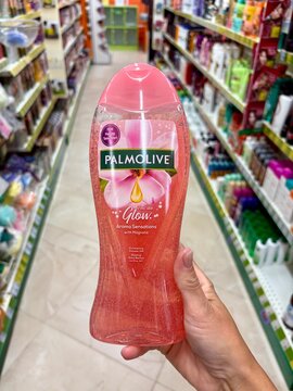 01.08.2026 Ukraine, Kharkov Woman Holding Palmolive Shower Gel Bottle in Supermarket