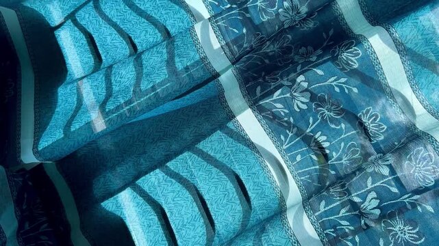 Sunlight Filtering Through Blue Floral Patterned Window Curtain