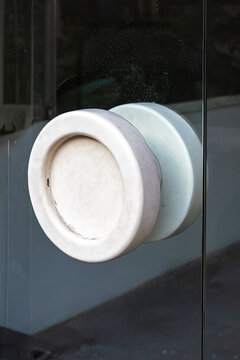 Large door knob on glass entrance door