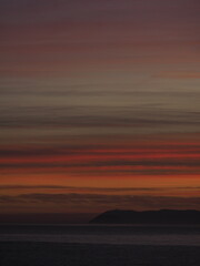 Fototapeta premium Colorful sunset over a calm sea horizon