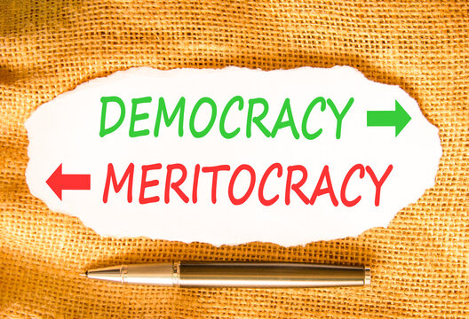 Democracy or meritocracy words symbol. Concept words Democracy Meritocracy on beautiful white paper. Beautiful canvas background. Business democracy meritocracy concept. Copy space