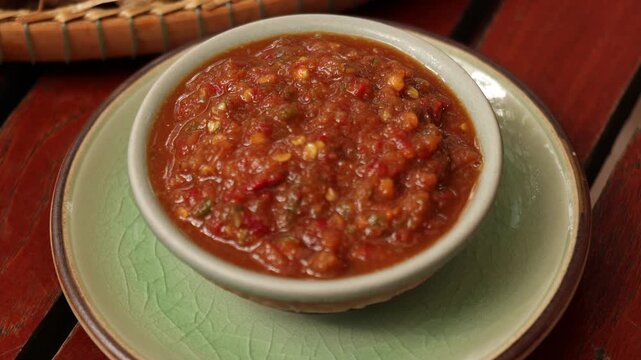 Thai Shrimp Paste Chili Dip (Nam Prik Kapi) with Fresh Vegetables on Wooden Table Thailand.