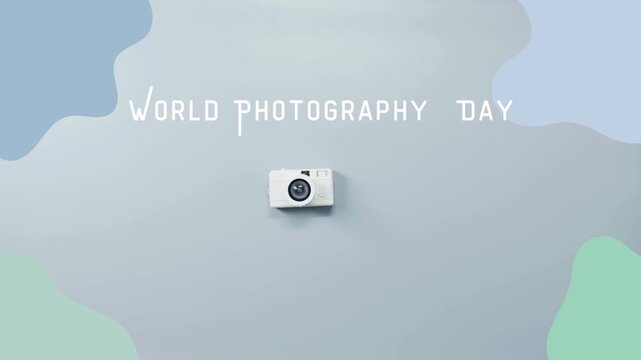 Stop motion animation of human hand placing white compact camera for world photography day celebration