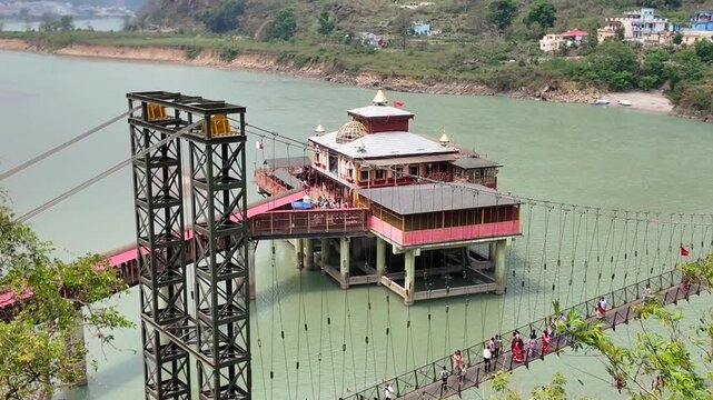 Pilgrims Crossing Suspension Bridge To Dhari Devi Temple