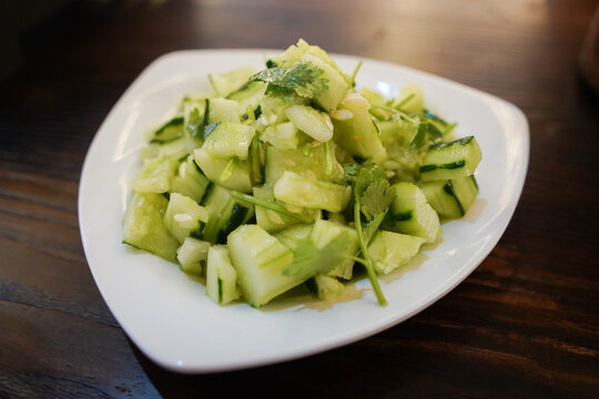 Close up of Chinese smashed cucumber salad with coriander